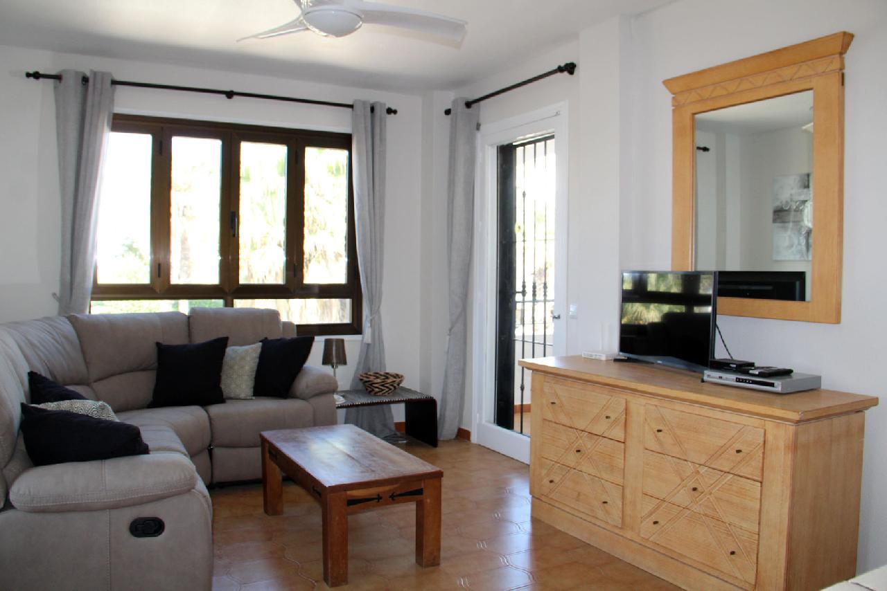 Akilar 1554124653WMGAYO ref 1739 mobile 2 Spacious Living room with UK TV Villamartin Plaza